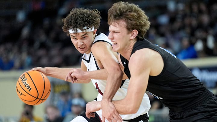 Owasso’s Jalen Montonati (1) works past Deer Creek’s Mason Smith (11) during the quarterfinals of the OSSAA 6A high school boys basketball tournament between Deer Creek and Owasso at State Fair Arena in Oklahoma City, on Tuesday, March 11, 2025.