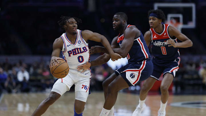 Feb 10, 2024; Washington, District of Columbia, USA; Philadelphia 76ers guard Tyrese Maxey (0) drives to the basket as Washington Wizards forward Eugene Omoruyi (97) defends in the first half at Capital One Arena. Mandatory Credit: Geoff Burke-Imagn Images
