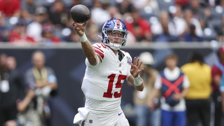 Aug 17, 2024; Houston, Texas, USA; New York Giants quarterback Tommy DeVito (15) attempts a pass during the third quarter against the Houston Texans at NRG Stadium. Mandatory Credit: Troy Taormina-USA TODAY Sports