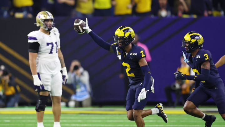 Jan 8, 2024; Houston, TX, USA; Michigan Wolverines defensive back Will Johnson (2) celebrates with defensive back Keon Sabb (3) after a turnover against the Washington Huskies during the third quarter in the 2024 College Football Playoff national championship game at NRG Stadium. Mandatory Credit: Thomas Shea-USA TODAY Sports