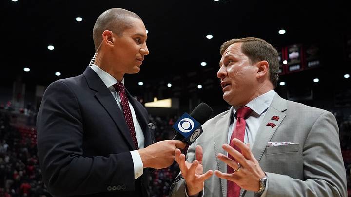 Feb 22, 2020; San Diego, California, USA; UNLV Rebels head coach T.J. Otzelberger (right) is interviewed by CBS Sports Network sideline reporter John Schriffen after defeating the San Diego State Aztecs at Viejas Arena. UNLV won 66-63. Mandatory Credit: Kirby Lee-USA TODAY Sports