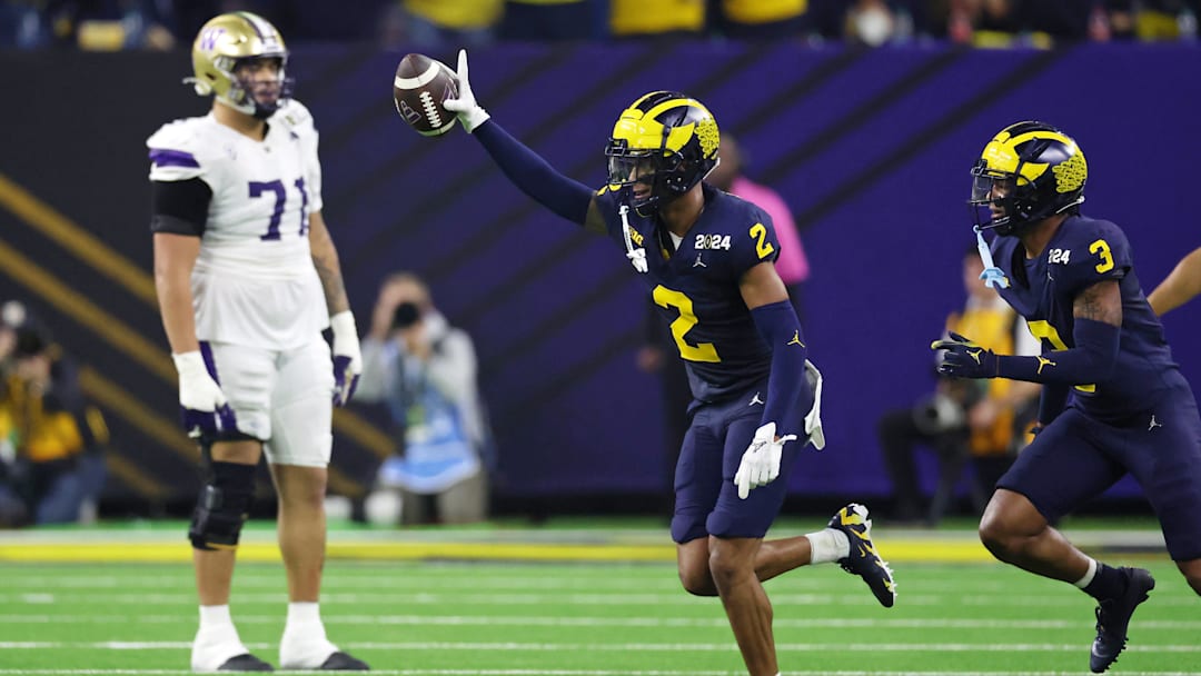 Jan 8, 2024; Houston, TX, USA; Michigan Wolverines defensive back Will Johnson (2) celebrates with defensive back Keon Sabb (3) after a turnover against the Washington Huskies during the third quarter in the 2024 College Football Playoff national championship game at NRG Stadium. Mandatory Credit: Thomas Shea-USA TODAY Sports