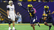 Jan 8, 2024; Houston, TX, USA; Michigan Wolverines defensive back Will Johnson (2) celebrates with defensive back Keon Sabb (3) after a turnover against the Washington Huskies during the third quarter in the 2024 College Football Playoff national championship game at NRG Stadium. Mandatory Credit: Thomas Shea-USA TODAY Sports