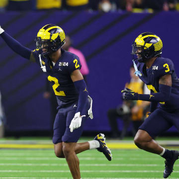 Jan 8, 2024; Houston, TX, USA; Michigan Wolverines defensive back Will Johnson (2) celebrates with defensive back Keon Sabb (3) after a turnover against the Washington Huskies during the third quarter in the 2024 College Football Playoff national championship game at NRG Stadium. Mandatory Credit: Thomas Shea-USA TODAY Sports