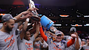 Mar 30, 2025; Atlanta, GA, USA; Auburn Tigers forward Johni Broome (4), left, guard Tahaad Pettiford (0) and head coach Bruce Pearl celebrate with teammates after winning the South Regional final of the 2025 NCAA tournament against the Michigan State Spartans at State Farm Arena. Mandatory Credit: Brett Davis-Imagn Images