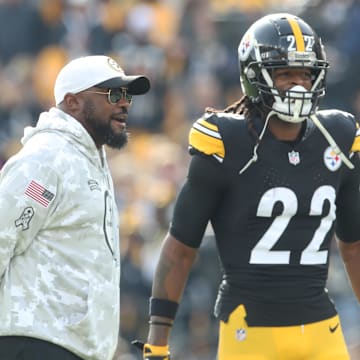 Nov 17, 2024; Pittsburgh, Pennsylvania, USA;  Pittsburgh Steelers head coach Mike Tomlin (left) and running back Najee Harris (22) talk during warm ups before the game against the Baltimore Ravens at Acrisure Stadium. Mandatory Credit: Charles LeClaire-Imagn Images