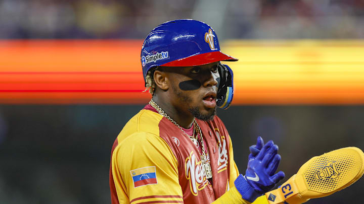 Mar 12, 2023; Miami, Florida, USA; Venezuela center fielder Ronald Acuna Jr. (42) reacts from third base during the first inning against Puerto Rico at LoanDepot Park. Mandatory Credit: Sam Navarro-Imagn Images