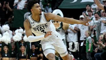 Mar 2, 2025; East Lansing, Michigan, USA;  Michigan State Spartans guard Jaden Akins (3) celebrates three three point shots in a row against the Wisconsin Badgers during the first half at Jack Breslin Student Events Center. Mandatory Credit: Dale Young-Imagn Images