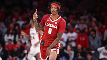 Nov 8, 2025; New York, New York, USA; Alabama Crimson Tide guard Labaron Philon (0) celebrates after making a three point shot in the second half against the St. John's Red Storm at Madison Square Garden.