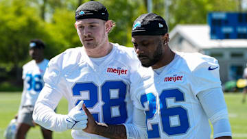 Detroit Lions safety Dan Jackson (28), left, shakes hands with former cornerback Duke Shelley (26) after practice during rookie mini camp at Meijer Performance Center in Allen Park on Friday, May 9, 2025.