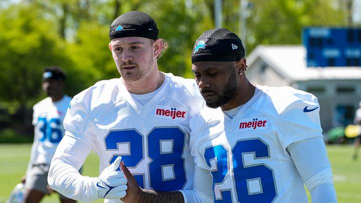 Detroit Lions safety Dan Jackson (28), left, shakes hands with former cornerback Duke Shelley (26) after practice during rookie mini camp at Meijer Performance Center in Allen Park on Friday, May 9, 2025.