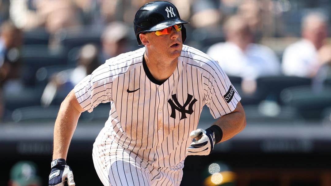 Jun 28, 2025; Bronx, New York, USA; New York Yankees second base DJ LeMahieu (26) singles during the eighth inning against the Athletics at Yankee Stadium. Mandatory Credit: Vincent Carchietta-Imagn Images