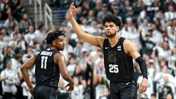 Michigan State's Malik Hall, right, celebrates his 3-pointer against Illinois during the first half