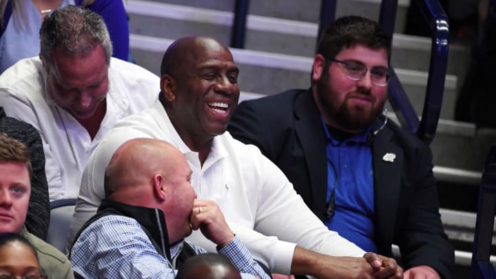 Mar 15, 2019; Nashville, TN, USA; Los Angeles Lakers president of basketball operations Magic Johnson talks with a fan during a game between the Kentucky Wildcats and the Alabama Crimson Tide in the SEC conference tournament at Bridgestone Arena. Mandatory Credit: Christopher Hanewinckel-USA TODAY Sports
