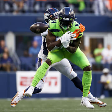 Sep 12, 2022; Seattle, Washington, USA; Denver Broncos cornerback Pat Surtain II (2) breaks up a pass intended for Seattle Seahawks wide receiver DK Metcalf (14) during the fourth quarter at Lumen Field.