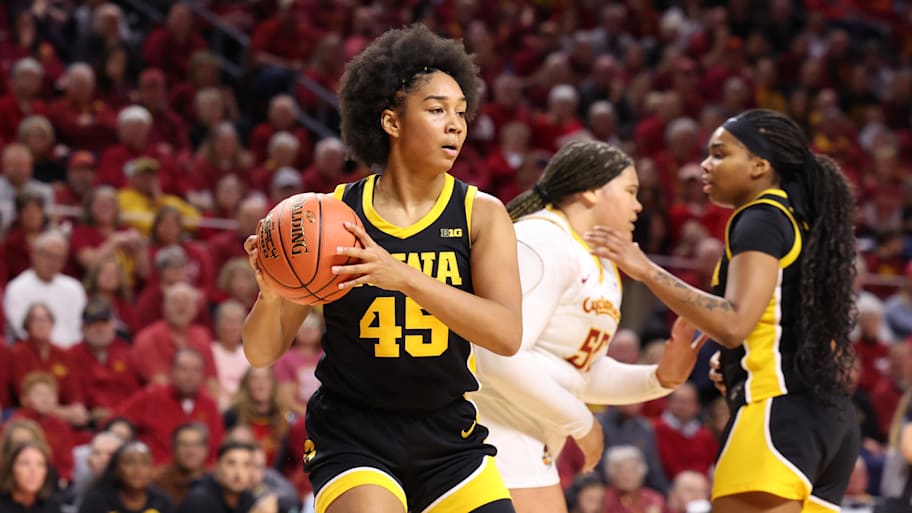 Iowa's Hannah Stuelke (45) grabs a rebound against Iowa State 
