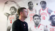 Ohio State basketball head coach Jake Diebler walks past a mural of former players after speaking to media prior to an offseason practice at the Schottenstein Center on June 18, 2025.