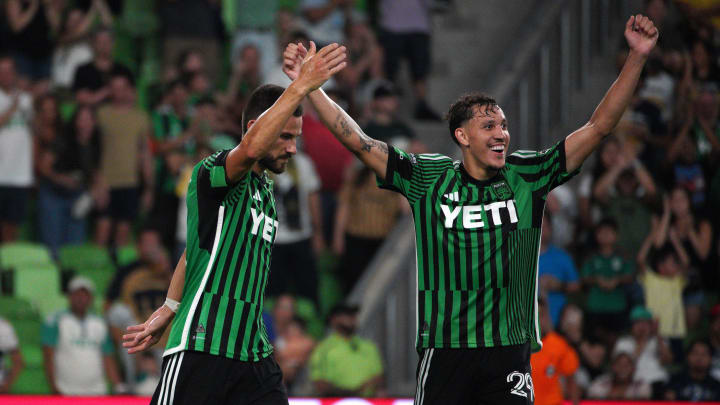 Jul 26, 2024; Austin, Texas, USA;  Austin FC defender Brendan Hines-Ike (4) and defender Guilherme Biro (29) celebrate a 3-2 win against Pumas UNAM at Q2 Stadium. Mandatory Credit: Dustin Safranek-USA TODAY Sports