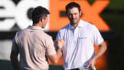 Aug 13, 2023; Memphis, Tennessee, USA; Rory McIlroy and Patrick Cantlay shake hands after their final round of the FedEx St. Jude Championship golf tournament. Mandatory Credit: Christopher Hanewinckel-USA TODAY Sports