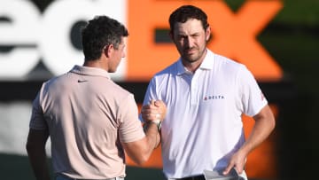 Aug 13, 2023; Memphis, Tennessee, USA; Rory McIlroy and Patrick Cantlay shake hands after their final round of the FedEx St. Jude Championship golf tournament. Mandatory Credit: Christopher Hanewinckel-USA TODAY Sports