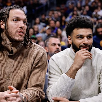 Mar 25, 2024; Denver, Colorado, USA; Denver Nuggets forward Aaron Gordon (L) and guard Jamal Murray (R) on the bench in the second quarter against the Memphis Grizzlies at Ball Arena. Mandatory Credit: Isaiah J. Downing-Imagn Images