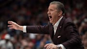 Arkansas Razorbacks coach John Calipari works the sideline against the South Carolina Gamecocks during their first round game of the SEC Men's Basketball Tournament at Bridgestone Arena in Nashville, Tenn.