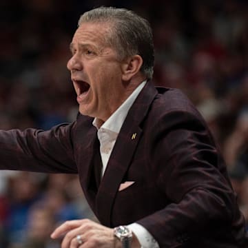 Arkansas Razorbacks coach John Calipari works the sideline against the South Carolina Gamecocks during their first round game of the SEC Men's Basketball Tournament at Bridgestone Arena in Nashville, Tenn.