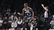 Apr 6, 2025; Brooklyn, New York, USA; Brooklyn Nets forward Dariq Whitehead (0) reacts to making a three point shot against the Toronto Raptors during the first half at Barclays Center. Mandatory Credit: Gregory Fisher-Imagn Images