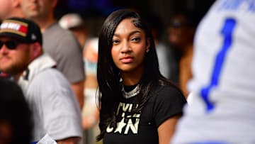 Reese attending an NFL game. 