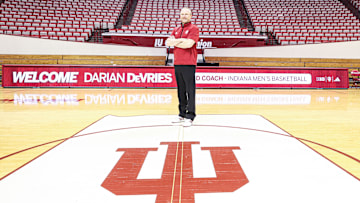 Indiana men's basketball coach Darian DeVries poses on the Simon Skjodt Assembly Hall court on March 18, 2025, the day he was introduced as the new coach.
