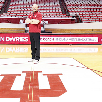 Indiana men's basketball coach Darian DeVries poses on the Simon Skjodt Assembly Hall court on March 18, 2025, the day he was introduced as the new coach.