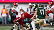 Dec 28, 2024; Tucson, AZ, USA; Miami (OH) RedHawks running back Kevin Davis (8) against the Colorado State Rams during the first half of the Snoop Dogg Arizona Bowl at Arizona Stadium. Mandatory Credit: Mark J. Rebilas-Imagn Images