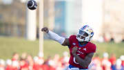 Kansas redshirt junior quarterback Jalon Daniels (6) fires off a pass during Friday's Spring Preview at Rock Chalk Park.