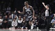 Apr 6, 2025; Brooklyn, New York, USA; Brooklyn Nets forward Dariq Whitehead (0) reacts to making a three point shot against the Toronto Raptors during the first half at Barclays Center. Mandatory Credit: Gregory Fisher-Imagn Images