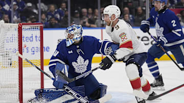 Toronto Maple Leafs goaltender Anthony Stolarz and Florida Panthers forward Sam Bennett battle for position.