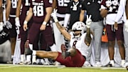 Nov 16, 2024; College Station, Texas, USA; New Mexico State Aggies defensive end Buddha Peleti (8) reacts after a tackle during the third quarter against the Texas A&M Aggies at Kyle Field. Mandatory Credit: Maria Lysaker-Imagn Images 