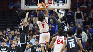 Jan 18, 2025; Newark, New Jersey, USA; St. John's basketball guard Simeon Wilcher (7) dunks the ball in front of Seton Hall Pirates guard Garwey Dual (33) during the second half at Prudential Center. 
