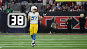 Jan 11, 2025; Houston, Texas, USA; Los Angeles Chargers outside linebacker Joey Bosa (97) reacts after sacking Houston Texans quarterback C.J. Stroud (7) (not pictured) in the first quarter in an AFC wild card game at NRG Stadium. Mandatory Credit: Thomas Shea-Imagn Images