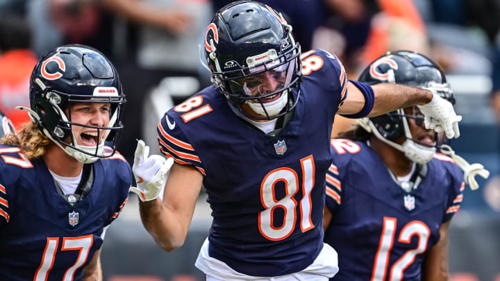 Dante Pettis celebrates with Tyson Bagent and Velus Jones Jr. after one of his two touchdown catches in Saturday's Bears win.