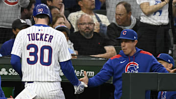 Chicago Cubs OF Kyle Tucker, manager Craig Counsell
