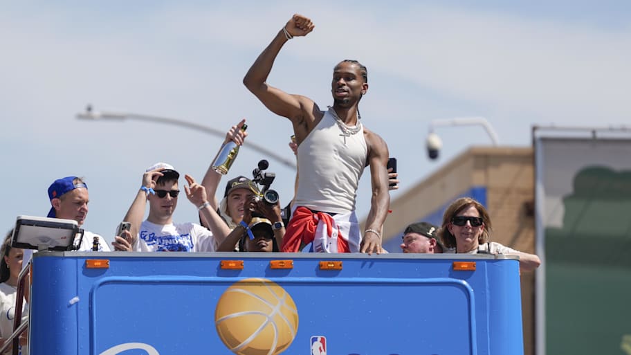 Oklahoma City Thunder guard Shai Gilgeous-Alexander gestures to the crowd at the celebratory parade. | Oklahoman-Imagn Images