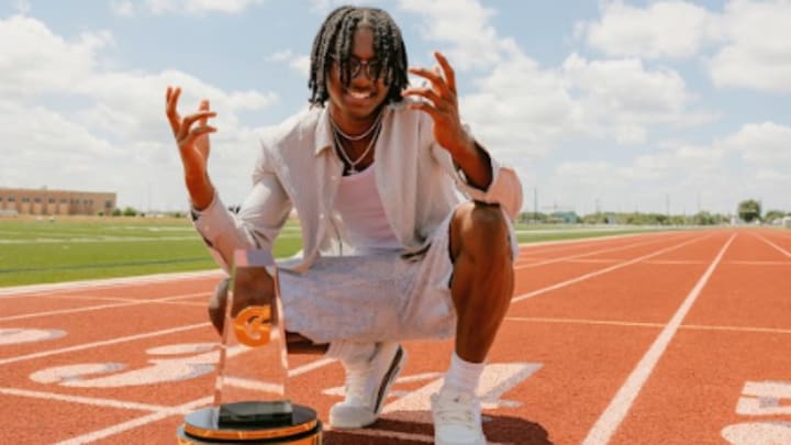 Tate Taylor poses with the 2025 Gatorade National Track and Field Player of the Year Award during a photoshoot after the surprise announcement on Thursday, July 26, 2025 at San Antonio's John M. Harlan High School.