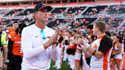 Oklahoma State Interim Head Coach/Offensive Coordinator Doug Meacham walks off the field following the college football game between the Oklahoma State Cowboys and the Baylor Bears at Boone Pickens Stadium in Stillwater, Okla., Saturday, Sept. 27, 2025.