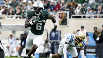 Oct 11, 2025; East Lansing, Michigan, USA; Michigan State wide receiver Nick Marsh (6) runs after catching the ball in the fourth quarter against the UCLA Bruins at Spartan Stadium. Mandatory Credit: Brendan Mullin-Imagn Images