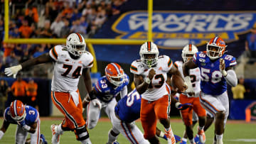 Aug 24, 2019; Orlando, FL, USA; Miami Hurricanes running back DeeJay Dallas (13) runs the ball for a touchdown against the Florida Gators during the second half at Camping World Stadium. Mandatory Credit: Jasen Vinlove-USA TODAY Sports