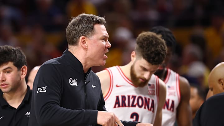 Jan 31, 2026; Tempe, Arizona, USA; Arizona Wildcats head coach Tommy Lloyd against the Arizona State Sun Devils in the second half at Desert Financial Arena. Mandatory Credit: Mark J. Rebilas-Imagn Images