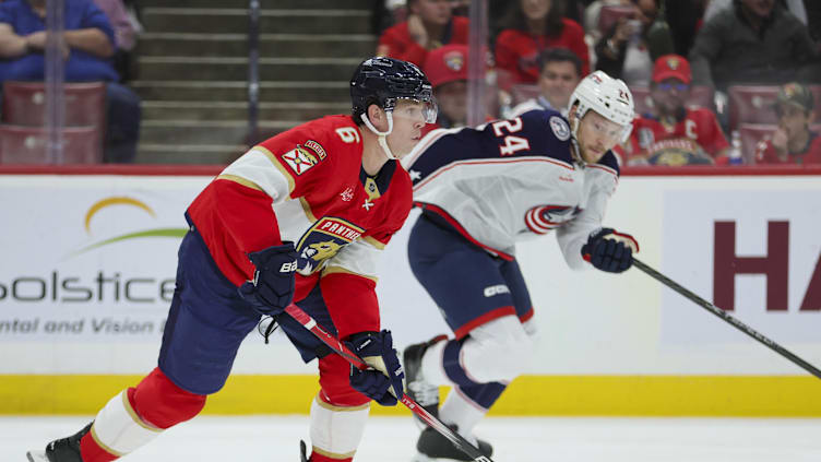 Nov 6, 2023; Sunrise, Florida, USA; Florida Panthers defenseman Mike Reilly (6) moves the puck