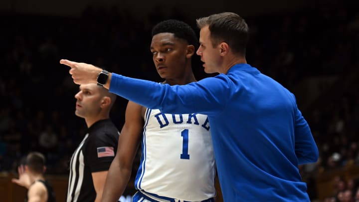 Duke basketball guard Caleb Foster and head coach Jon Scheyer