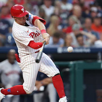 Aug 27, 2024; Philadelphia, Pennsylvania, USA; Philadelphia Phillies outfielder Austin Hays (9) hits a double against the Houston Astros during the third inning at Citizens Bank Park.