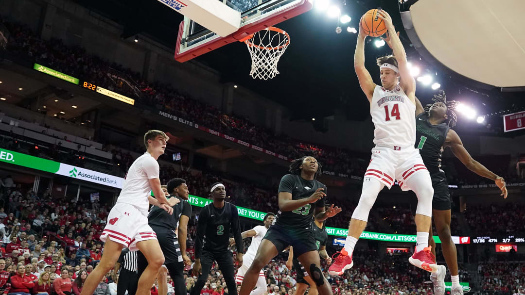 Dec 22, 2023; Madison, Wisconsin, USA; Wisconsin Badgers forward Carter Gilmore (14) rebounds the ball.